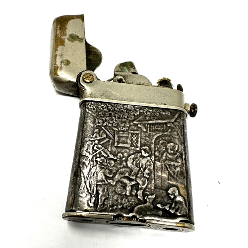 39 - Vintage Thorens silver lighter, a rare Swiss claw lighter marked 935 with repousse work to sides