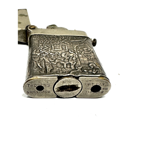 39 - Vintage Thorens silver lighter, a rare Swiss claw lighter marked 935 with repousse work to sides