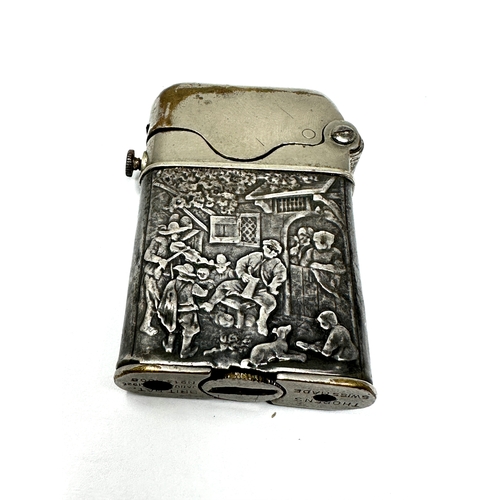 39 - Vintage Thorens silver lighter, a rare Swiss claw lighter marked 935 with repousse work to sides