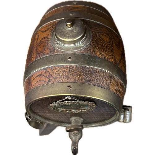 194 - A vintage retro brandy dispenser / decanter in the form of a wooden barrel raised on four splayed le... 