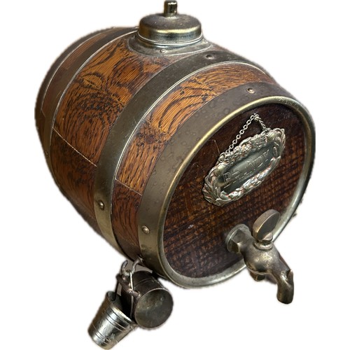 194 - A vintage retro brandy dispenser / decanter in the form of a wooden barrel raised on four splayed le... 