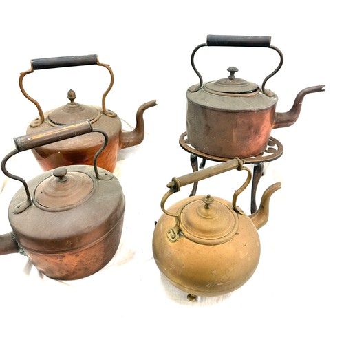 117 - Selection of vintage copper and brass kettles with one stand