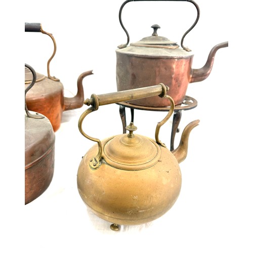 117 - Selection of vintage copper and brass kettles with one stand