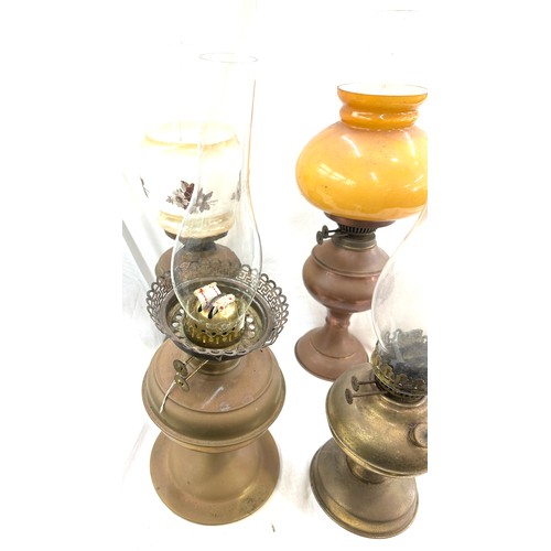 250 - Selection of copper and brass vintage oil lamps with funnels, tallest measures approximately 23 inch... 