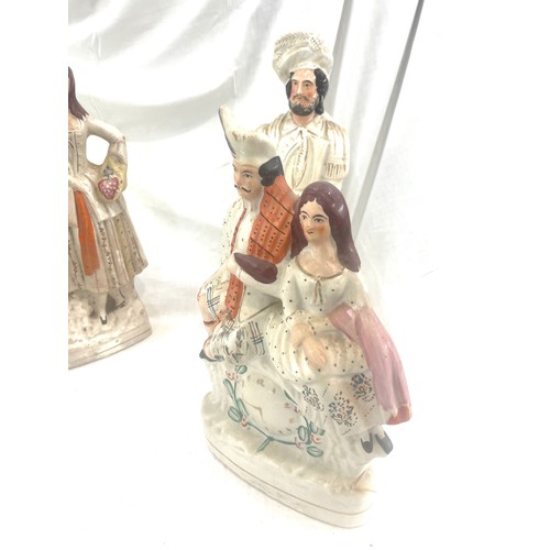 98 - 4 Antique Staffordshire figures, tallest measures approximately: 17.5 inches