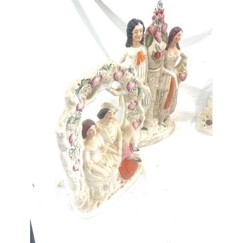 98 - 4 Antique Staffordshire figures, tallest measures approximately: 17.5 inches