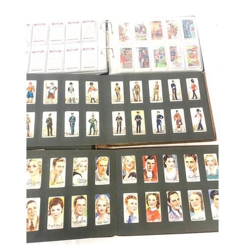 73 - Selection of cigarette/ tea/ collectors cards in four albums includes full sets includes players, wi... 