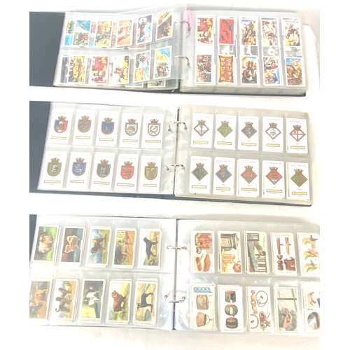 69 - Selection of cigarette/ tea/ collectors cards in three albums includes full sets includes players, w... 