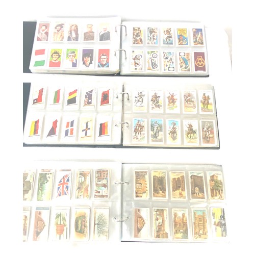 69 - Selection of cigarette/ tea/ collectors cards in three albums includes full sets includes players, w... 