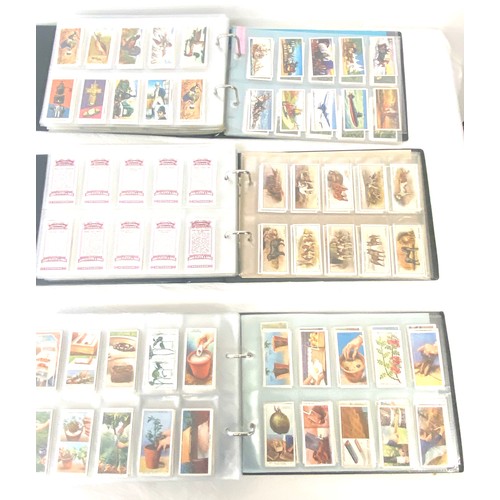 69 - Selection of cigarette/ tea/ collectors cards in three albums includes full sets includes players, w... 