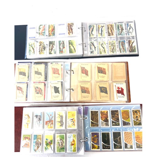 88 - Selection of cigarette/ tea/ collectors cards in three albums includes full sets includes players, w... 