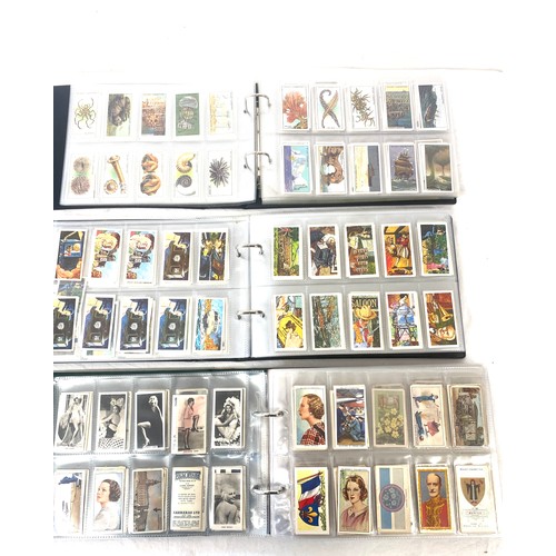 72 - Selection of cigarette/ tea/ collectors cards in three albums includes full sets includes players, w... 