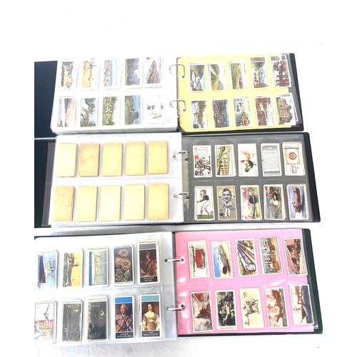 72 - Selection of cigarette/ tea/ collectors cards in three albums includes full sets includes players, w... 