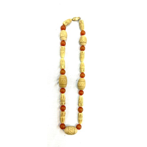 444 - Vintage carved boho and amber necklace