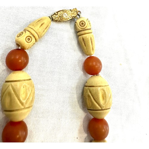 444 - Vintage carved boho and amber necklace