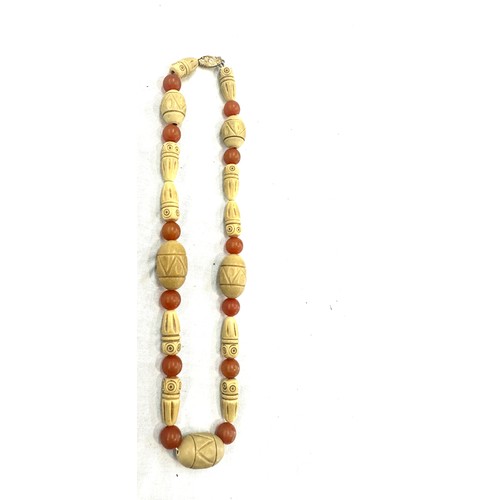 444 - Vintage carved boho and amber necklace