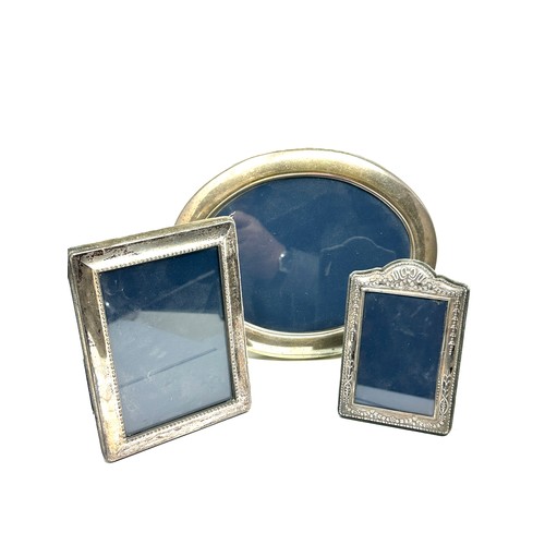 107 - 3 x .925 sterling silver picture frames lrgest measures approx 22cm by 17cm