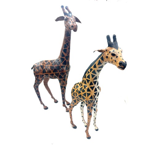 94 - 2 leather giraffe figures, tallest measures approximately 21 inches tall