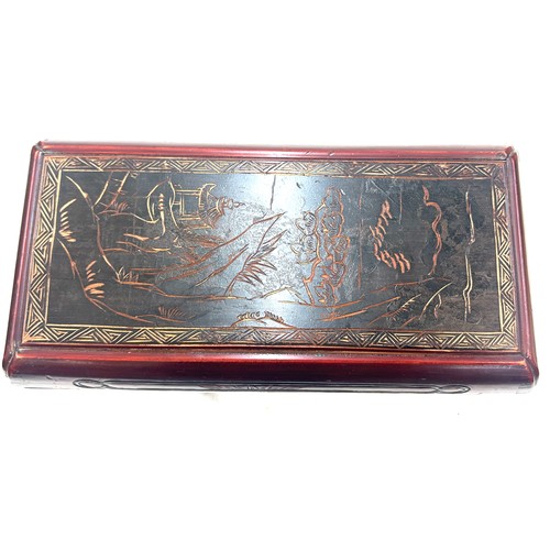 16 - Oriental carved red and black lacquered box measures approximately 17 inches wide 7 inches tall 9 in... 