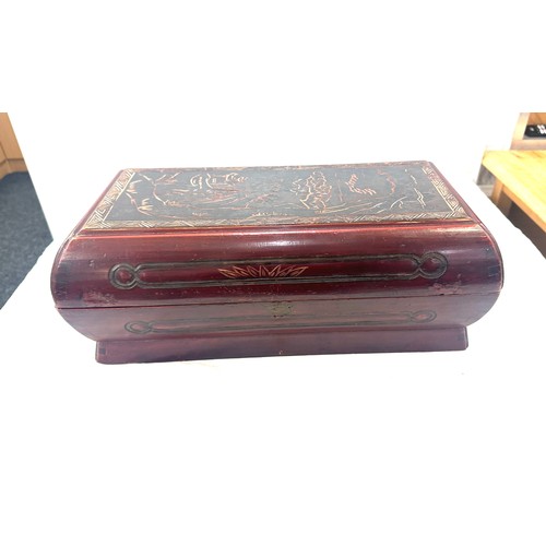 16 - Oriental carved red and black lacquered box measures approximately 17 inches wide 7 inches tall 9 in... 