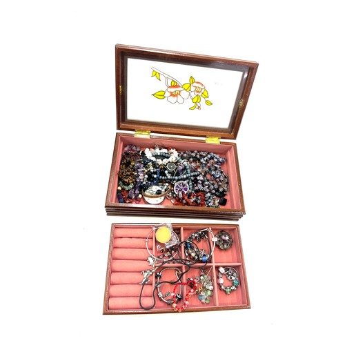 405 - Selection of vintage and later costume jewellery includes silver charm bracelets, scottish brooch, b... 