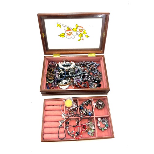 405 - Selection of vintage and later costume jewellery includes silver charm bracelets, scottish brooch, b... 