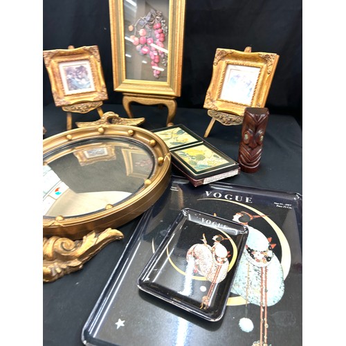 143 - Selection of collectable items to include Eagle mirror, place mats, stands etc