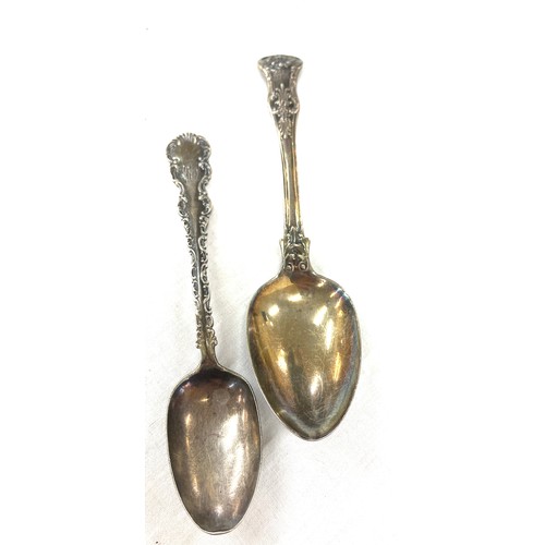 319 - 2 Antique silver ornate spoons, total weight 95 grams