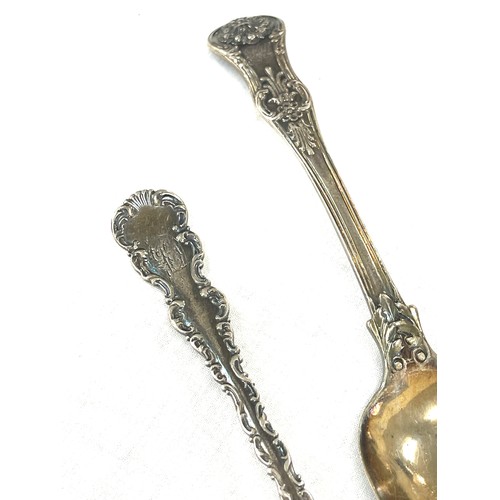 319 - 2 Antique silver ornate spoons, total weight 95 grams