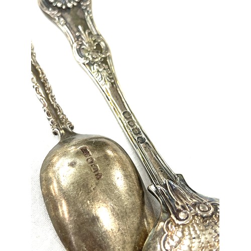 319 - 2 Antique silver ornate spoons, total weight 95 grams