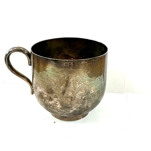 307 - Unmarked silver mug, engraved MCS, approximate weight 132g, Height 3 inches