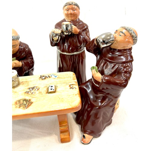 384 - 4 ceramic friars drinking and gambling sat by a ceramic table, tallest friar measures approximately ... 