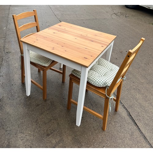 275 - Pine table and two chairs