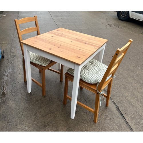 275 - Pine table and two chairs