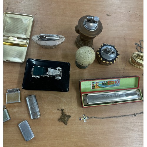 105 - Selection of vintage collectable items to include lighters, whistles et