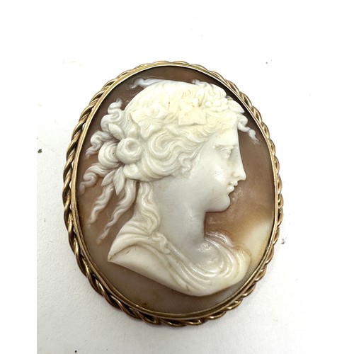 83 - 9ct gold carved shell cameo brooch (11.7g)