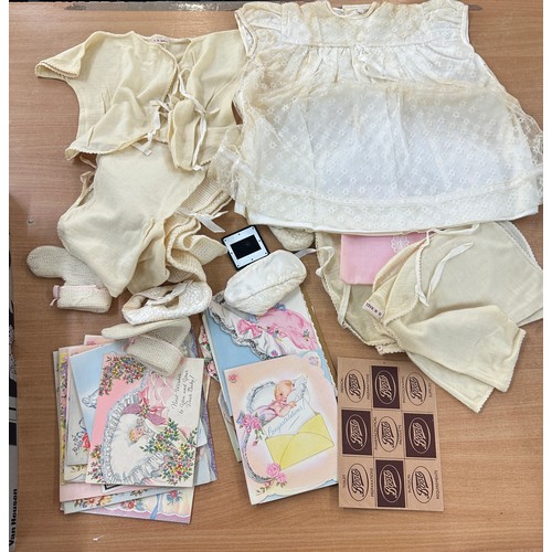 113 - Vintage baby clothing in a box