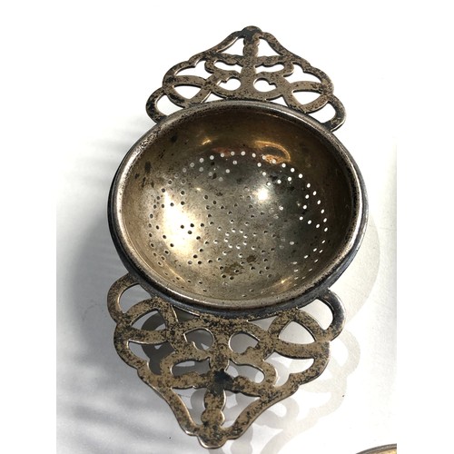 442 - 2 silver spoons and silver tea strainer