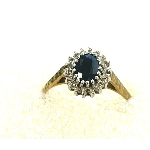 569 - 9ct Gold diamond & sapphire cluster ring