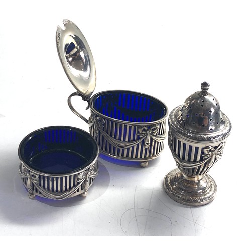 438 - Antique silver cruet set blue glass liners