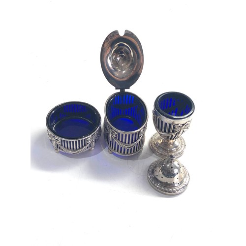 438 - Antique silver cruet set blue glass liners