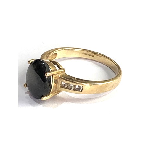 594 - 9ct gold black star sapphire ring 2.9g