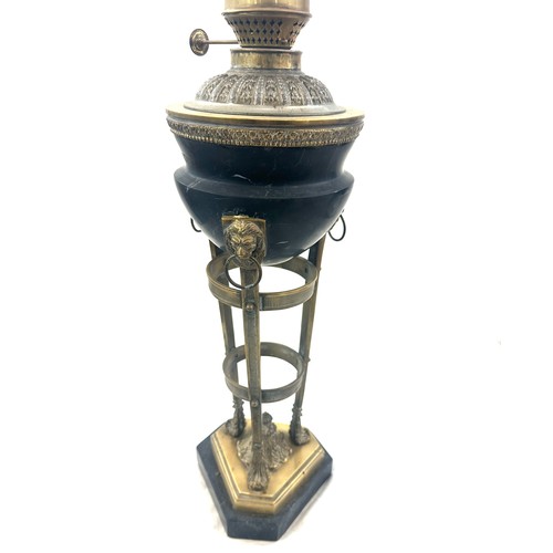 376 - Victorian brass base oil lamp with lion knocker design, with funnel, height approximately