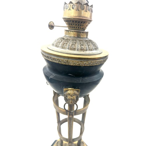 376 - Victorian brass base oil lamp with lion knocker design, with funnel, height approximately