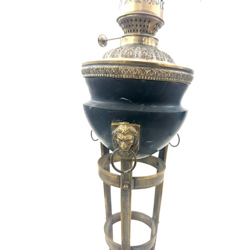 376 - Victorian brass base oil lamp with lion knocker design, with funnel, height approximately