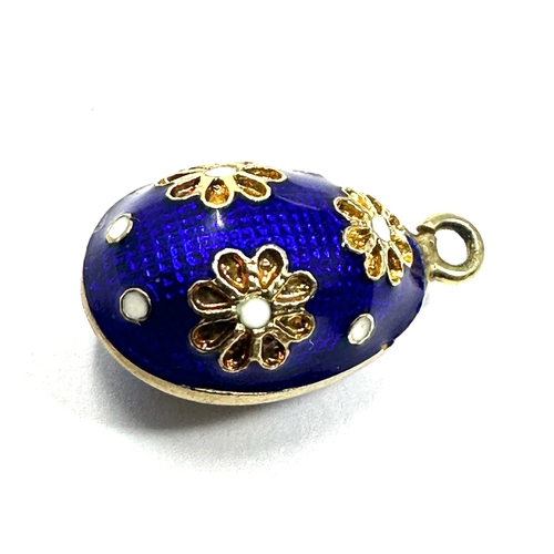 37 - gold & enamel egg charm measures approx 19mm drop by 11mm wide weight 2.6g