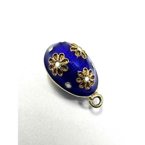 37 - gold & enamel egg charm measures approx 19mm drop by 11mm wide weight 2.6g