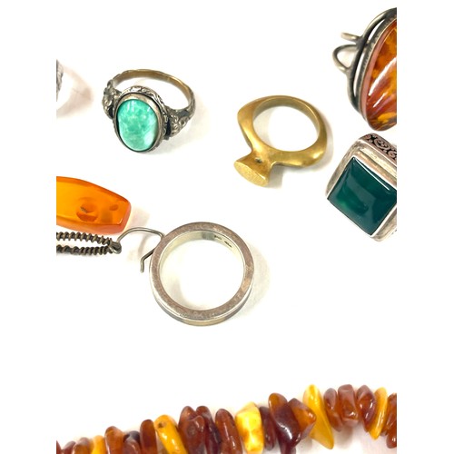 437 - Vintage amber jewellery to include silver rings etc