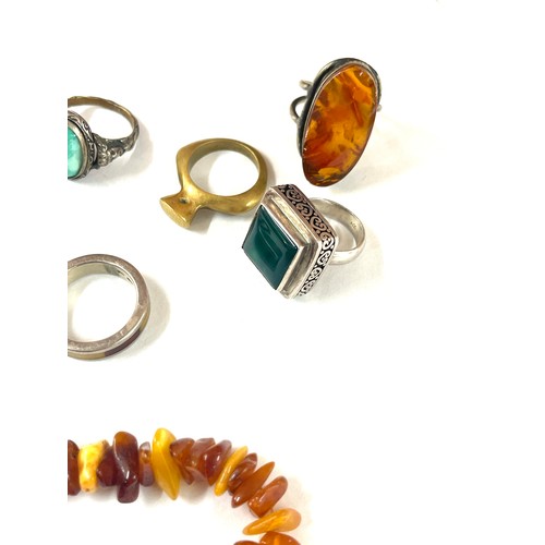 437 - Vintage amber jewellery to include silver rings etc