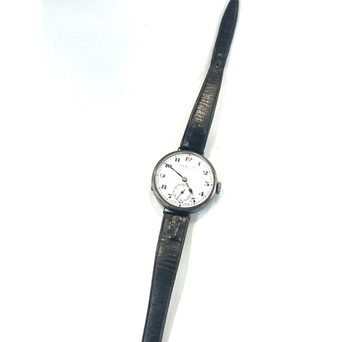 439 - WW1 period Benson military trench watch with a silver case, winds up and ticks